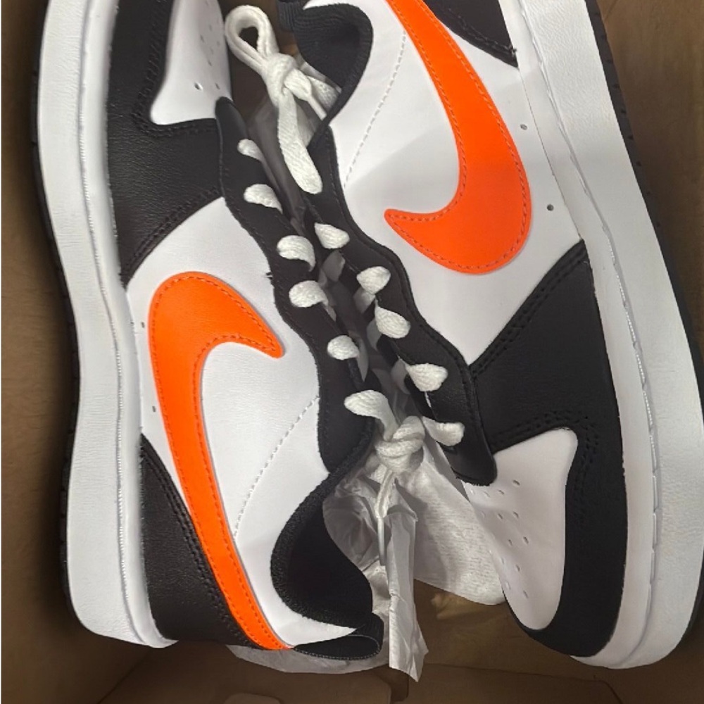 Nike Black and White Sneakers with Orange Swoosh